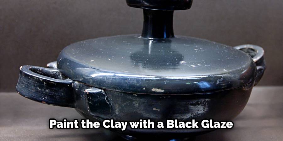 Paint the Clay with a Black Glaze