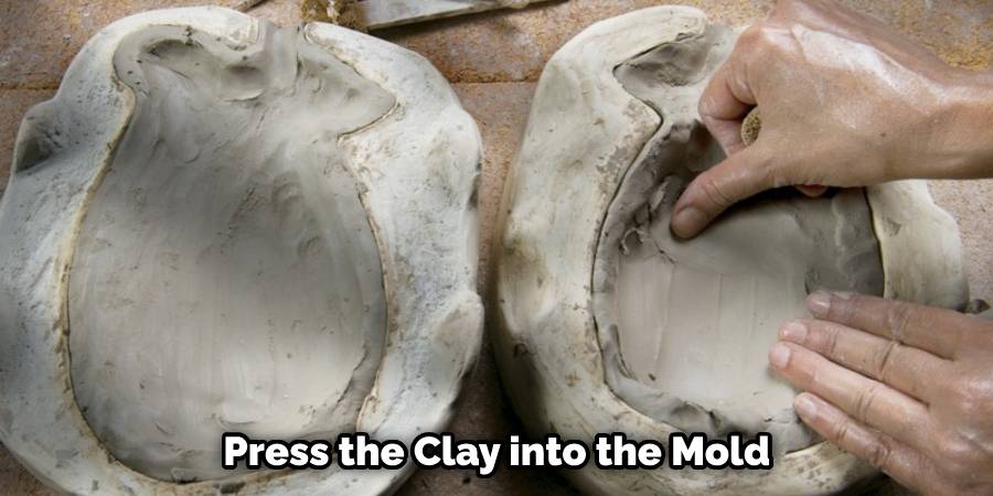 Press the Clay into the Mold