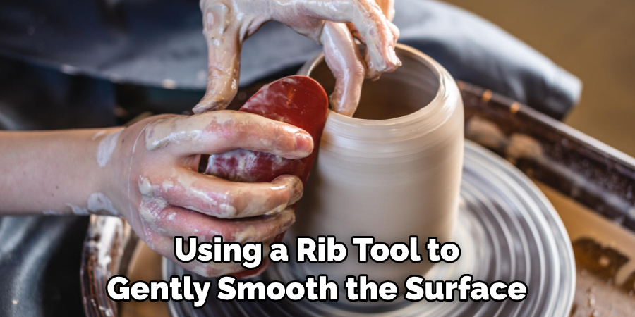 Using a Rib Tool to Gently Smooth the Surface