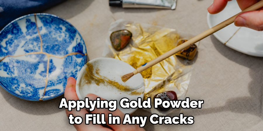 Applying Gold Powder to Fill in Any Cracks