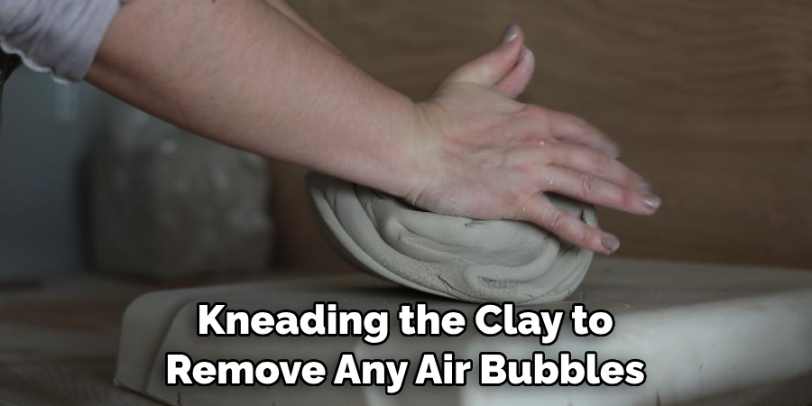 Kneading the Clay to Remove Any Air Bubbles